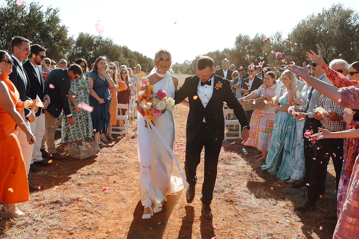 Red dirt and dirt bikes at Courtney Scott and Nick Ringk’s Charleville wedding